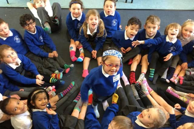 Reception class pupils at Our Lady and St Edward's Primary School in Fulwood throw their feet behind World Down Syndrome day