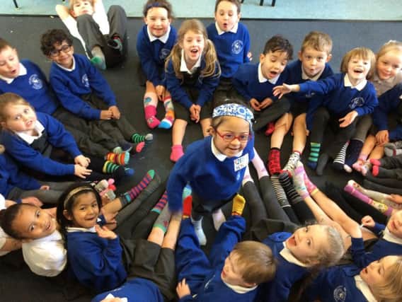 Reception class pupils at Our Lady and St Edward's Primary School in Fulwood throw their feet behind World Down Syndrome day