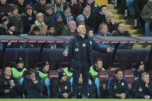 Alex Neil with his coaching staff at Villa Park