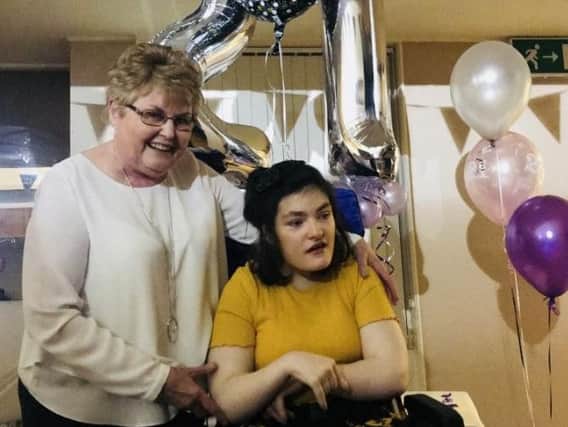 Sinead Joyce, with Helen Byrne, her longest serving carer, has celebrated her 21st birthday