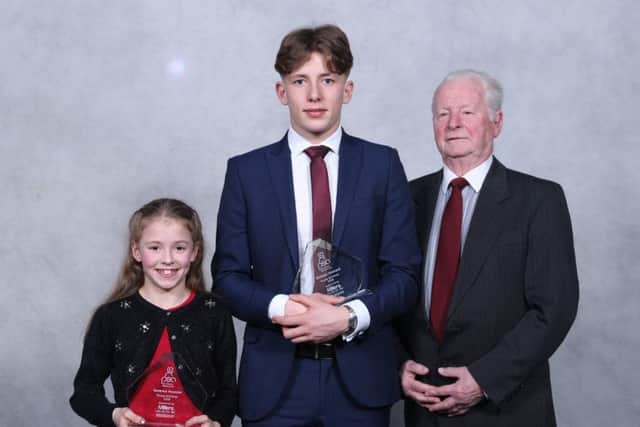 Young Achiever joint winners Gemma Vescovi (left) and William Howard (middle) with Brian Finney on behalf of Millers Taxis