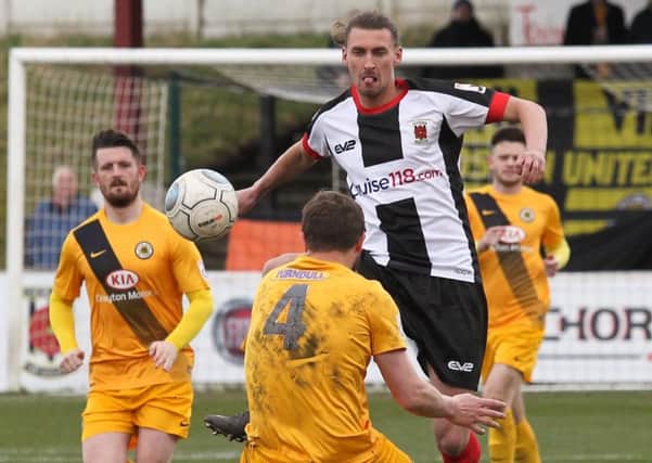 Dale Whitham wins the ball in the middle of the park for the Magpies against Boston (photo: Josh Vosper)