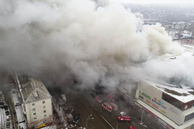 At least three children and a woman have died in a fire that broke out in a multi-story shopping center in the Siberian city of Kemerovo.