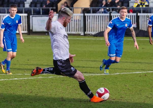 Adam Dodd misses from the penalty spot against Glossop. Photo: Ruth Hornby