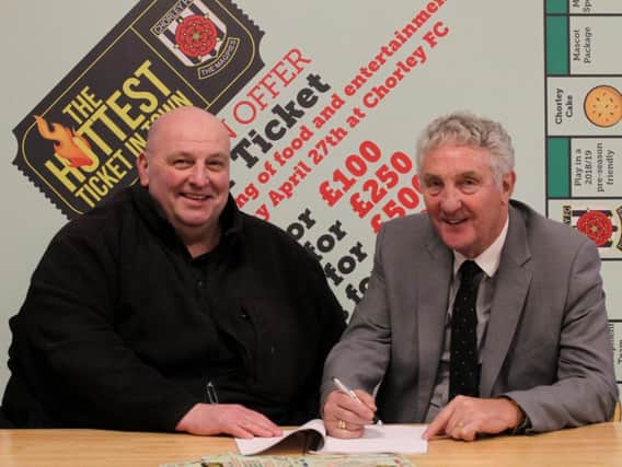 Chorley FC chairman Ken Wright and secretary Graham Watkinson sign the lease for the club's ground