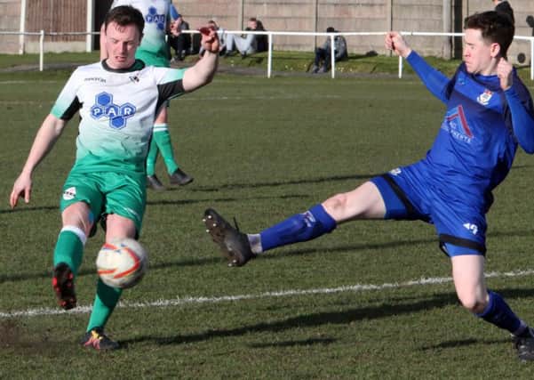 Charnock's Nathan Fairhurst in action against Squires Gate