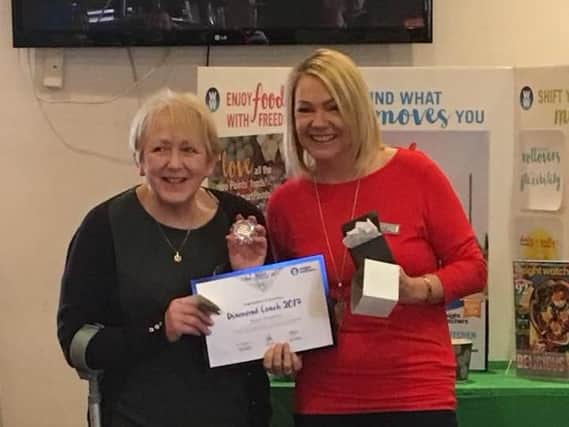 Karen Shepherd receives her Weight Watchers Diamond Award from Area Service Manager Louise Horrocks