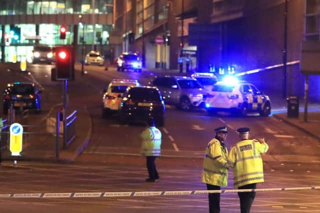 Emergency services at Manchester Arena after reports of an explosion at the venue during an Ariana Grande gig.