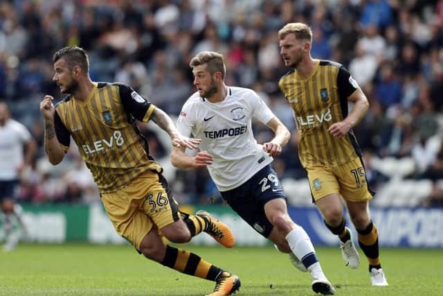 Tom Barkhuizen pursues Sheffield Wednesday's Daniel Pudil in PNE's 1-0 win over the Owls last August