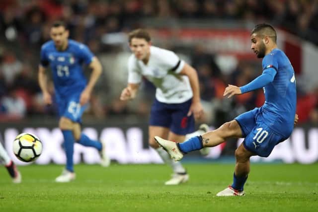 England debutant James Tarkowski (centre) can only watch as Lorenzo Insigne fires home a penalty which earned Italy a 1-1 draw at Wembley