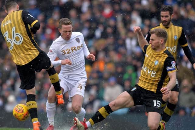 Tom Lees, right, in the thick of the action against Leeds.