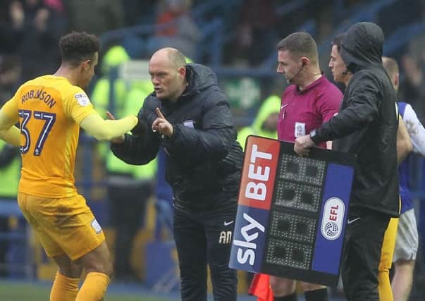 Alex Neil delivers some instructions to Callum Robinson during Preston's defeat to Sheffield Wednesday at Hillsborough on Good Friday