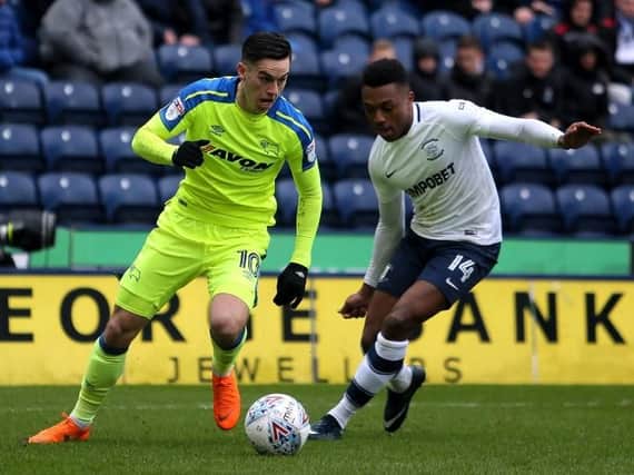 Darnell Fisher battles with Derby's Tom Lawrence.