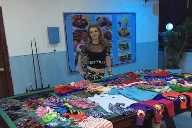 Ellis Matthews with some of the clothes she collected