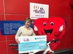 Val Makinson presents her cheque to Heartbeat