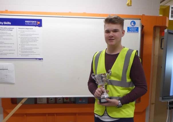 Preston's College  student Jamie Stanley from Clayton-le-Woods  pictured with his infinity table after being named Gorilla Glue Apprentice of the Year