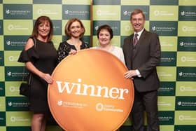 Tracey Jones and Angela Livesey (middle) from Garstang Community Academy receive the award. Photo: Les Gibbon.