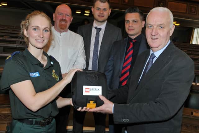 Preston councillor Coun Tony Jones pictured with, from left, paramedic Cheryl Pickstock, and the trio who came to the aid of Tony and gave him CPR, Coun John Fillis, BBC political reporter Mike Stevens and facilities manager Matt Dean
