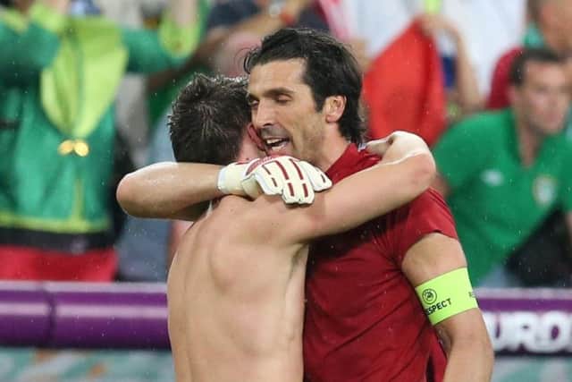 Sean St Ledger hugs Italy keeper Gianluigi Buffon at Euro 2012