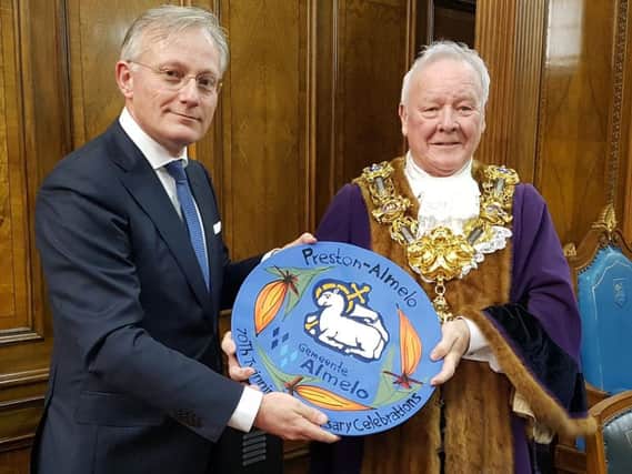 Almelo Mayor Arjen Gerritsen and Preston Mayor Brian Rollo with the 70th anniversary commemorative plate.