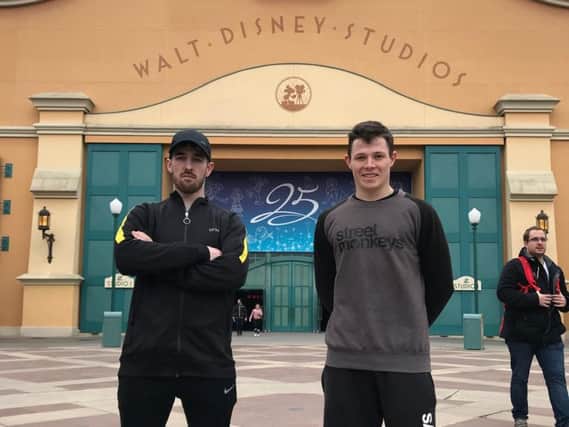Bam and Sean outside Walt Disney Studios in Paris.