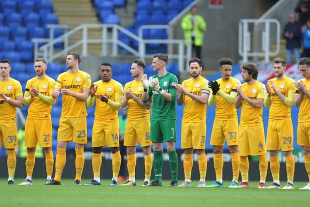 PNE players take part in a minute's applause at Reading in memory of Ray Wilkins