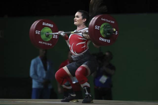England's Sarah Davies competes in women's 69Kg weightlifting final at the Commonwealth Games in Gold Coast, Australia