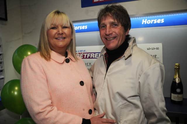 Rennick with partner Sue at the Betfred shop in Heysham.