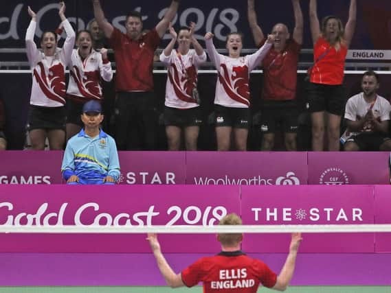Chloe Birch, back left, celebrates Team England's bronze medal