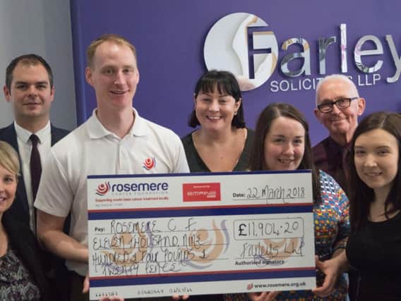 Rosemeres Cathy Skidmore (far left) and the charitys fundraising manager Dan Hill receive Farleys donation from Stephen Greenwood, Antonia Love, Reta Madigan and Sophie Henrys watched by chairman of the charitys 20 Years Anniversary Appeal Committee Frank Stoner (second from the right)