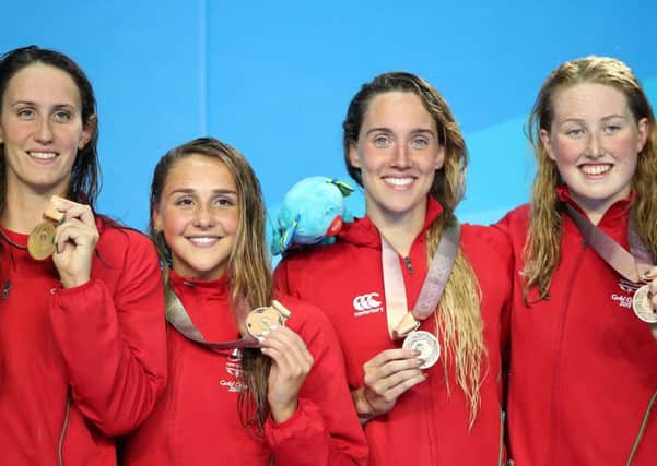 Wales' Georgia Davies (left), Chloe Tutton, Alys Thomas and Kathryn Greenslade (right) celebrate with their medals after the Women's 4 x 100m medley relay final
