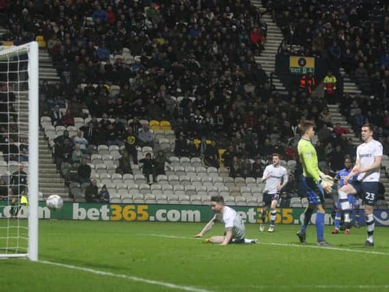 Sean Maguire watches his header go into the net to give PNE the lead against Leeds