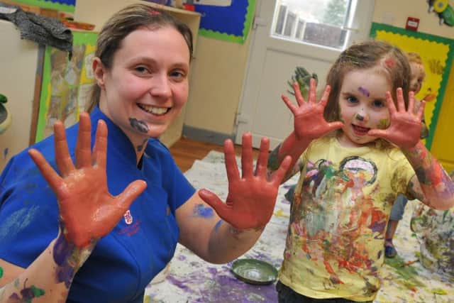 LEP - NEW LONGTON   01-03-18
Katie Eddowes, left, with kids enjoy getting messy as they have a paint fight to celebrate Holi, at Elizabeth Saunders Nursery, New Longton.