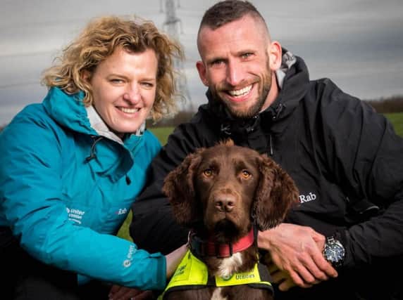 United Utilities Leakage Manager Hannah Wardle, Snipe the dog and his trainer Ross Stephenson