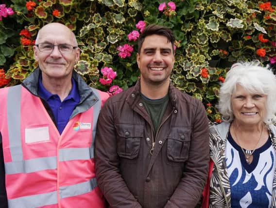 Presenter Chris Bavin with gardeners from Chorley in Bloom
