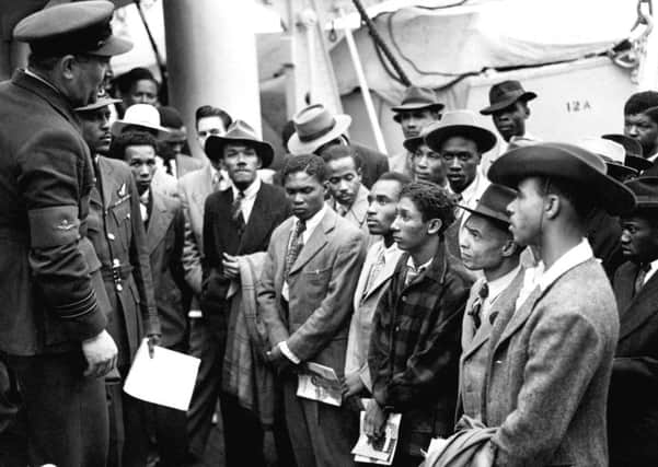 Jamaican immigrants being welcomed by RAF officials at Tilbury after the Empire Windrush docked in 1948.