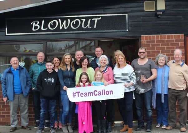 Erin Gibbons with her team of supporters outside Blow Out, in Leyland