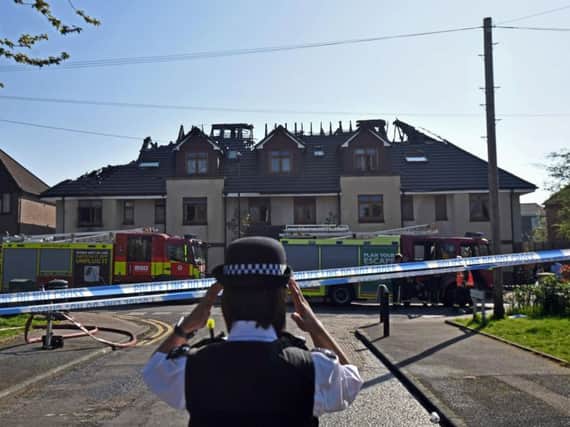 Emergency services attend the scene of a care home for adults with learning difficulties in Chingford, east London, where a woman died in an overnight fire. Photo credit: Victoria Jones/PA Wire