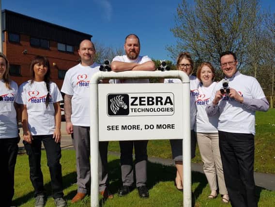 left to right - Magda Kalita, Karolina Scigala, Steve Blackburn, Lee Nuttall, Debbie Sutton, Catherine Clayton, Graham Robinson from Zebra Technologies who will be taking part in the Great Manchester Run. (other members running include Ian Macleod & Natalie Blackburn)