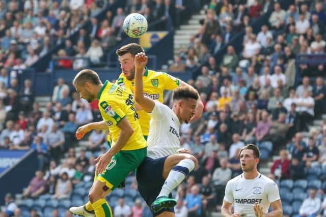 Callum Robinson challenges in the air