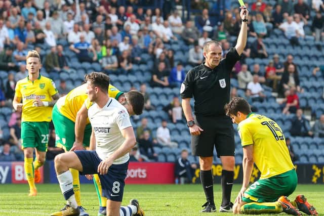 Norwich defender Timm Klose is booked for a foul on Alan Browne