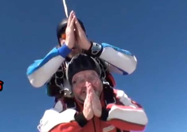 Archdeacon of Lancaster Michael Everitt prays above the skies of Lancashire. Picture by Black Knights Parachute Centre.