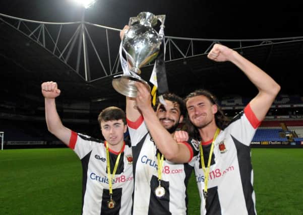 Chorley scorers Luke Burgess, Delial Brewster and Dale Whitham with the trophy