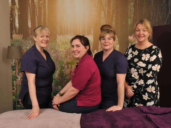 Katie McNally with therapists Lisa Kennedy, Charlotte Underwood and Emma Avhede in the health and wellbeing facility at Derian House
