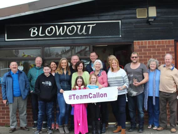 Erin Gibbons with her team of supporters outside Blow Out, in Leyland