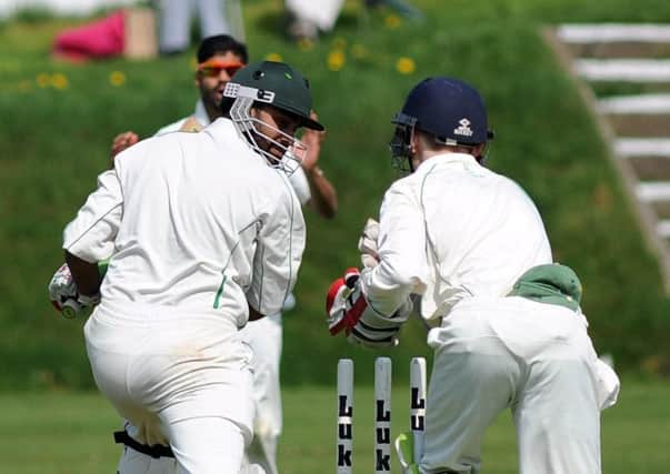 Chorley wicketkeeper Harry Barclay whips the bails off Rahman Shah's stumps but the Preston batsman survived