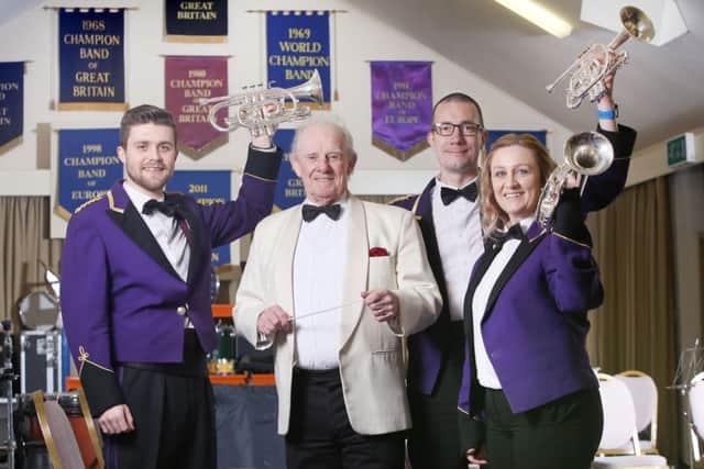Picture: Lorne Campbell / Guzelian
Derek Broadbent with members of the world famous Brighouse and Rastrick Brass Band. It is 40 years since Derek conducted the West Yorkshire band, and made it to number two in the charts with `The Floral Dance'. The song was further popularised when Terry Wogan added his singing to the tune. From left are cornet players, Sam Gibson, Simon Sanderson and Hayley Walsh.
PICTURE TAKEN ON MONDAY 20 MARCH  2017
WORDS BY GUZELIAN

A conductor who helped resurrect a popular 1911 song by Katie Moss and turned it into a chart hit will perform with former members of his brass band to celebrate 40 years since its success. 

Derek Broadbent, of Bradford, West Yorkshire, is responsible for the Brighouse & Rastrick Band's arrangement of The Floral Dance, which charted in at number two back in December 1977.

Mr Broadbent will be reuniting with his former players and current members of the band on Saturday, March 25, at Huddersfield Town Hall, to conduct a special concert to celebrate the 40t