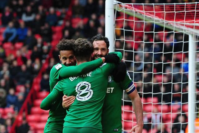 Alan Browne is congratulated by Callum Robinson and Greg Cunningham after scoring PNE's winner
