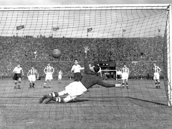 George Mutch scores from the penalty spot to win the FA Cup for Preston against Huddersfield at Wembley in 1938