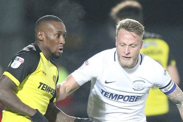 Tom Clarke challenges Lloyd Dyer in PNE's 2-1 win at Burton in December